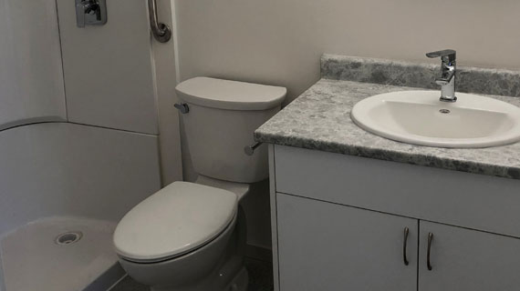 P-bath image of a bathroom with sink and shower and toilet